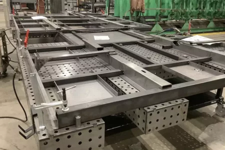 Flextur Welding Table with Flextur Accessories and Item Being Setup for Welding