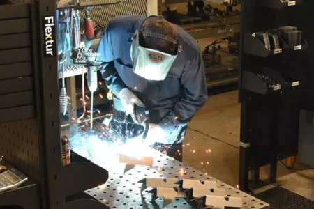 Man Welding on Flextur Welding Table