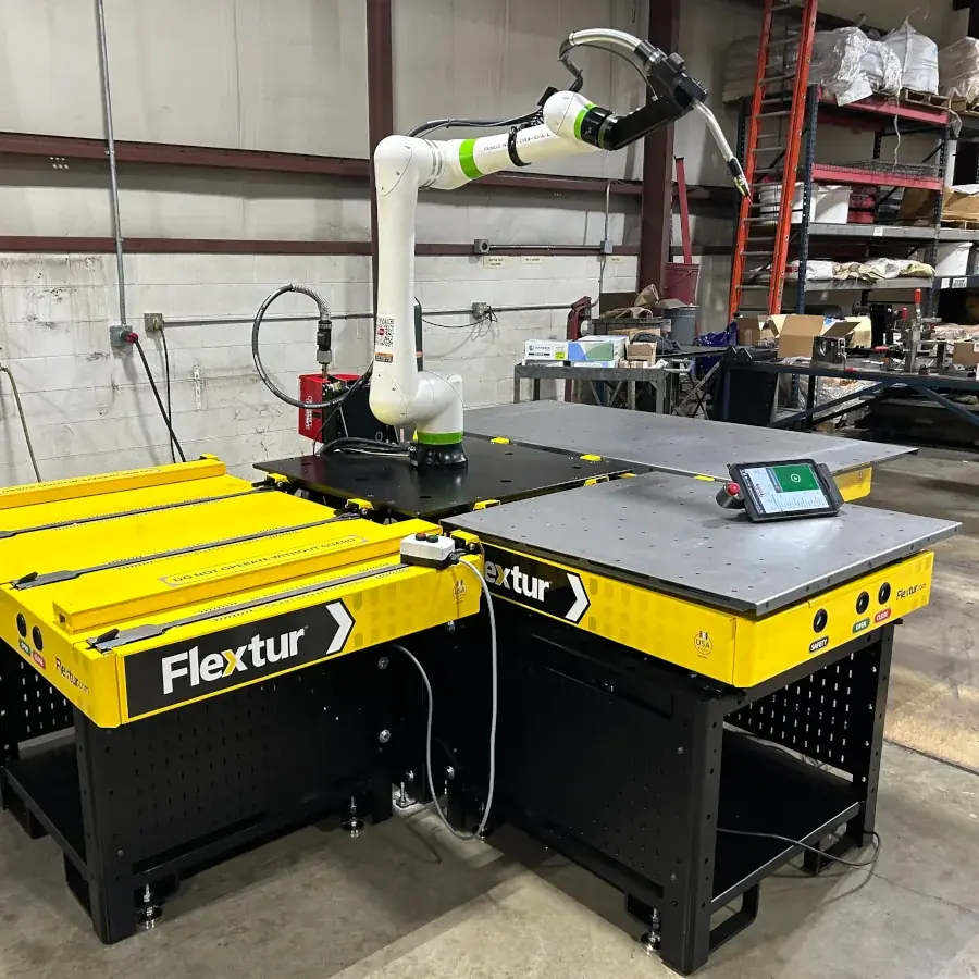 Flextur Cobot Docking Station with Cobot Arm and 36" x 36" and 36" x 72" Quick Change Tables.