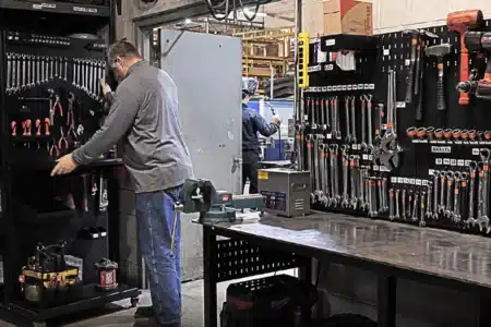 Maintenance room with Flextur tool boards and workbenches for organized workspace